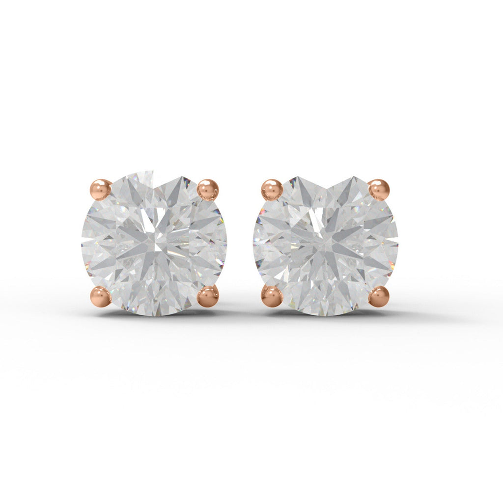 Pair of rose gold moissanite stud earrings on a white background