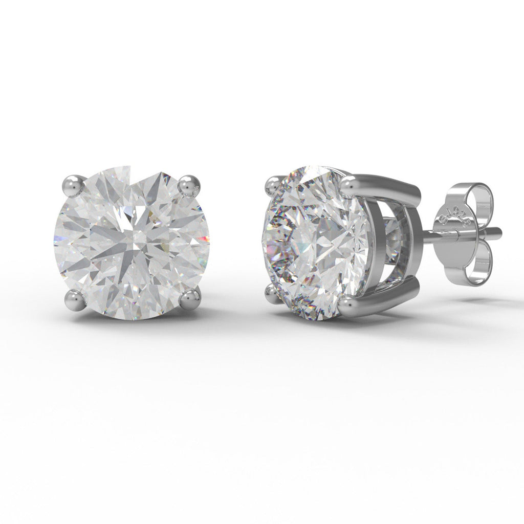Pair of sterling silver moissanite stud earrings on a white background