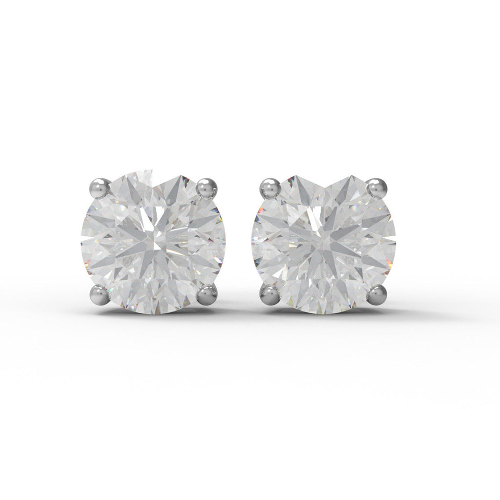 Pair of sterling silver moissanite stud earrings on a white background
