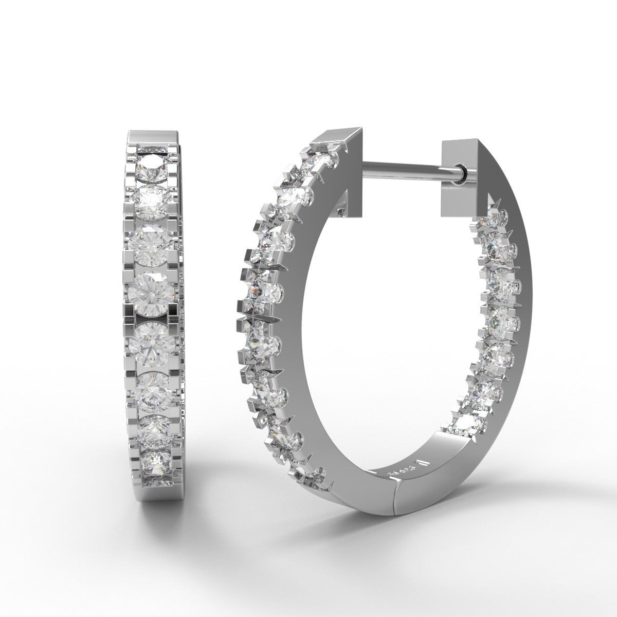 Sterling silver in and out moissanite hoop earrings on a white background