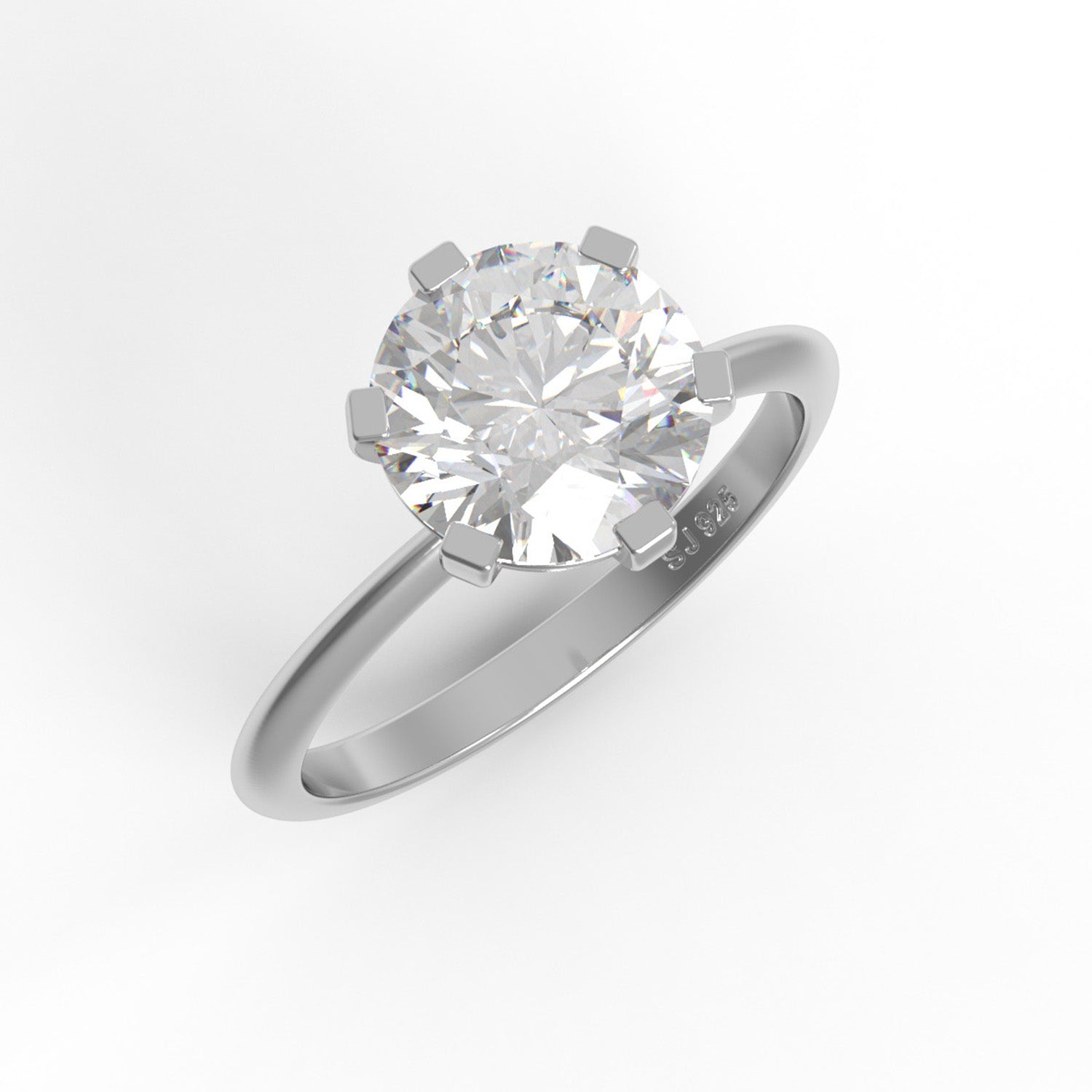 Round-cut sterling silver moissanite solitaire ring on a white background